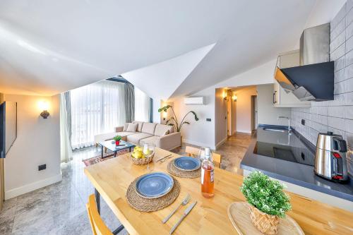 a kitchen and living room with a dining table in a apartment at Sole Vista Homes in Kas