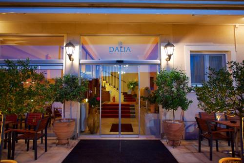 a restaurant with a glass door with a sign that reads daria at Hotel Dalia in Corfu