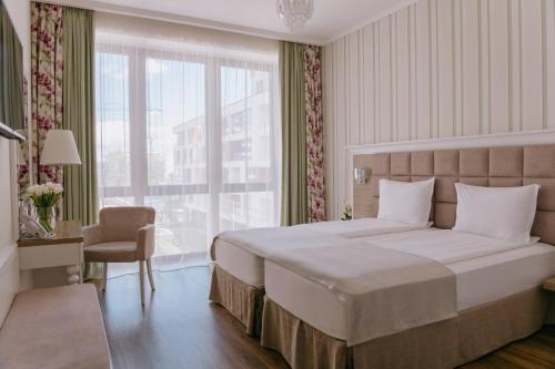 Postel nebo postele na pokoji v ubytování Impresamente Art Hotel