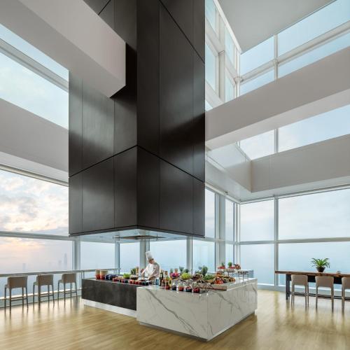 a kitchen with a counter with fruits and vegetables at Mandarin Oriental, Shenzhen in Shenzhen