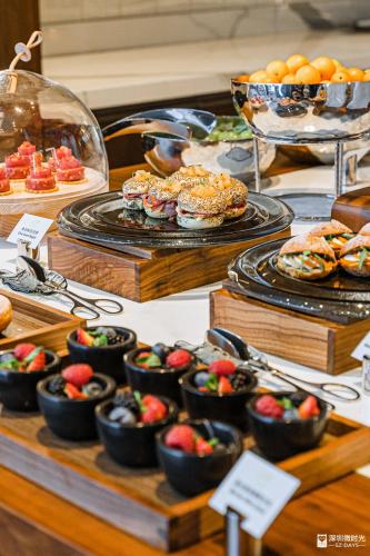 a buffet of desserts and pastries on a table at Mandarin Oriental, Shenzhen in Shenzhen
