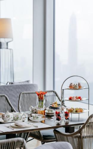 a table with plates of food on it at Mandarin Oriental, Shenzhen in Shenzhen