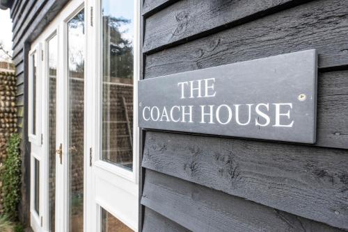 a sign on the door of a coach house at The Coach House, Reydon in Reydon