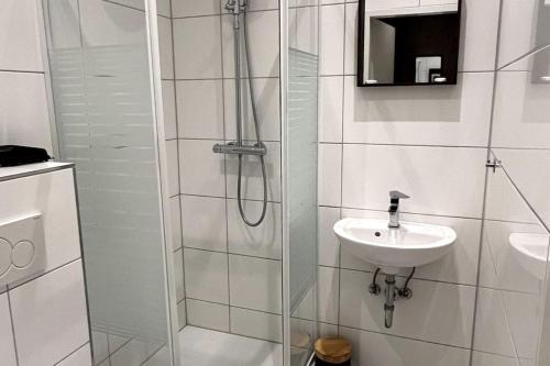 a bathroom with a shower and a sink at Relax in Duisburg