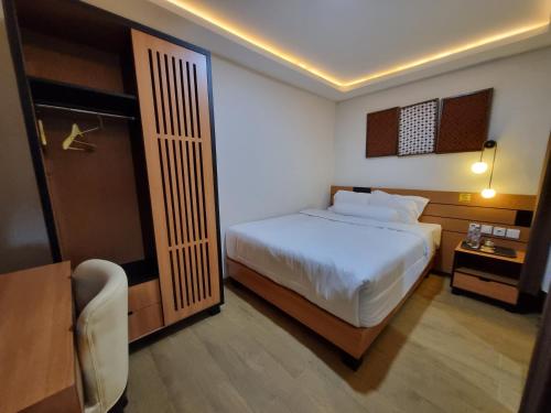 מיטה או מיטות בחדר ב-Griya Endika Syariah