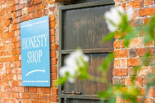 a sign on the side of a brick building at Teal - Exton Park in Exton