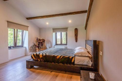 a bedroom with a large bed in a room at Villa di John in Umbertide