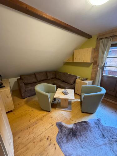 a living room with a couch and a table at Chata Piecky in Hrabušice