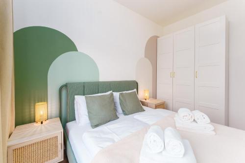 a bedroom with a bed with two towels on it at Apartament Gaya23 Ku Morzu in Sianozety