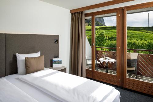 Letto o letti in una camera di Hotel und Naturhaus Bellevue