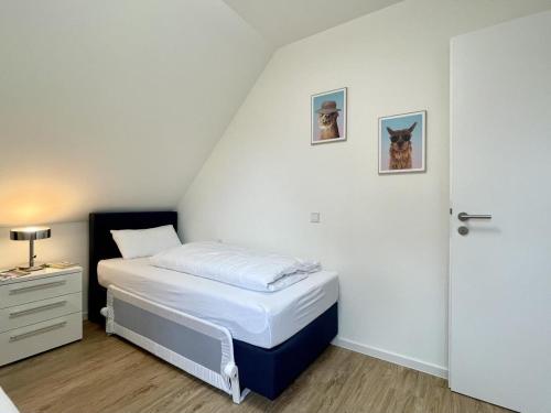 Postel nebo postele na pokoji v ubytování Am Kutterhafen 26 - Nordsee-Loft