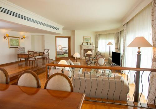 a living room with a couch and a table at Movenpick Taba Resort & Spa in Taba