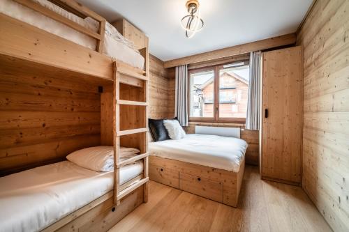 Ένα ή περισσότερα κρεβάτια σε δωμάτιο στο Apartment Koya Alpe D'Huez - by EMERALD STAY