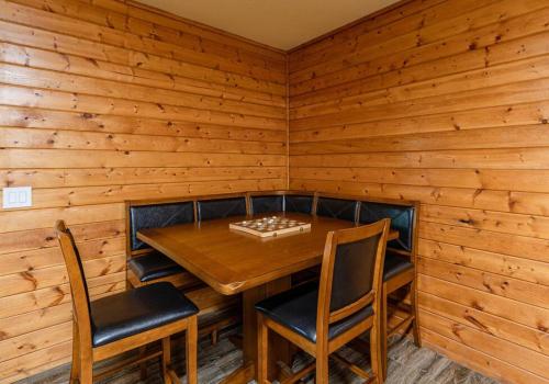 a dining room with a wooden table and chairs at Lakefront Point Retreat on Nantahala Lake with Dock in Topton