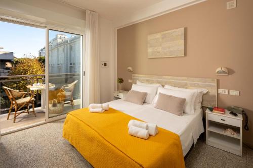 Postel nebo postele na pokoji v ubytování Hotel Maestri