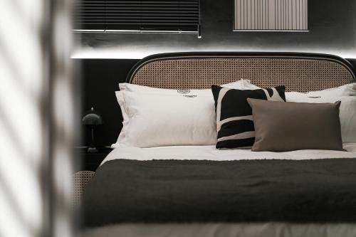 Ένα ή περισσότερα κρεβάτια σε δωμάτιο στο We2 Design Hotel