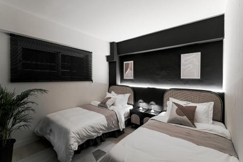 Ένα ή περισσότερα κρεβάτια σε δωμάτιο στο We2 Design Hotel