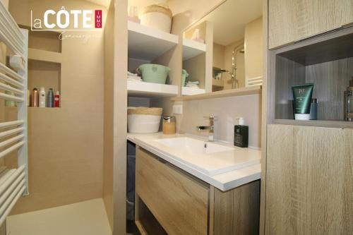 a bathroom with a sink and a counter at Les Jardins in Carry-le-Rouet