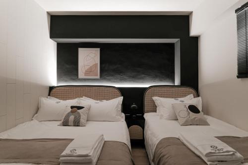 Ένα ή περισσότερα κρεβάτια σε δωμάτιο στο We2 Design Hotel