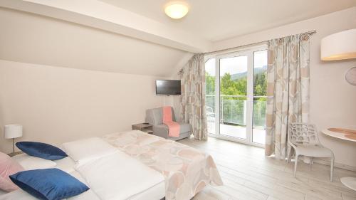 เตียงในห้องที่ Tignes - Czarna Góra Resort by Sun & Snow z nielimitowanym basenem