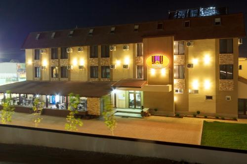 a building with a sign on the side of it at YMY HOTELS Târgu Jiu in Târgu Jiu