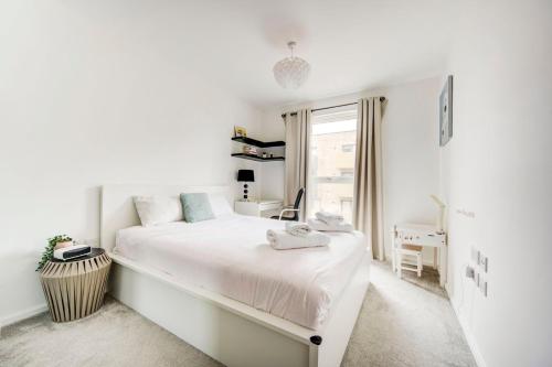 Postelja oz. postelje v sobi nastanitve GuestReady - Cosmopolitan Living in Hounslow