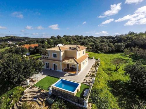 an aerial view of a house with a swimming pool at Luxury holiday escape in the countryside tavira in Tavira