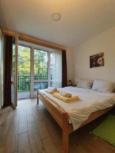 Postel nebo postele na pokoji v ubytování Apartmani Milutinovic