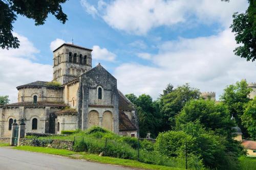 an old church on the side of a road at Gîte au Bray in Bellenaves