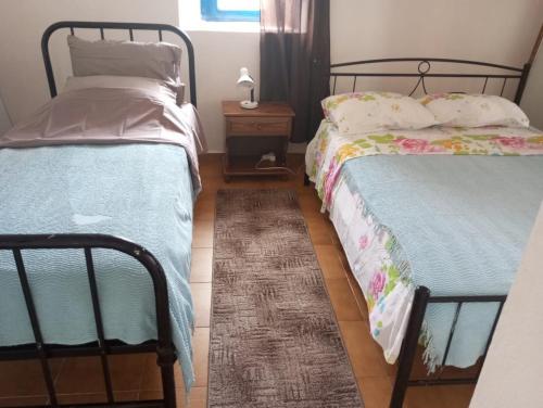 Postel nebo postele na pokoji v ubytování In Mylopotamos Beautiful apartment, good price!