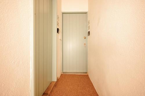 an empty hallway with a door in a room at GuestReady - Casas Do Tanoeiro in Porto Brandão