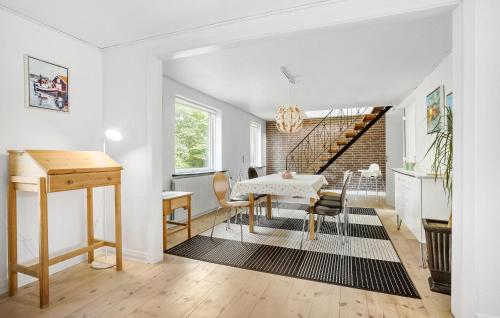 a kitchen and dining room with a table and chairs at Lovely Home In Højslev With Wifi in Højslev