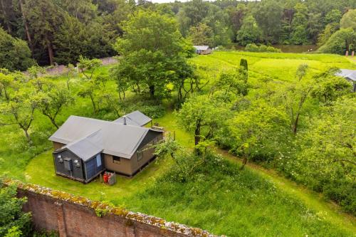 an aerial view of a tiny house in a field at Kite - Exton Park in Exton