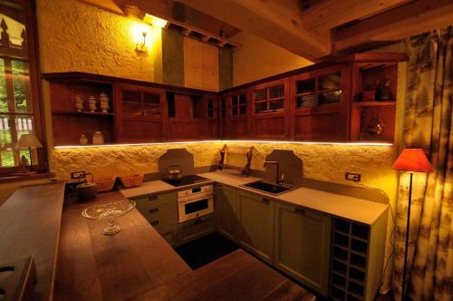 a kitchen with a sink and a counter top at Chalet Pra Dell OSTIO Primiero San Martino di Castrozza in Fiera di Primiero