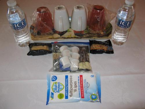 a table with a package of food and two bottles of water at Fairhaven Hotel in Llandudno