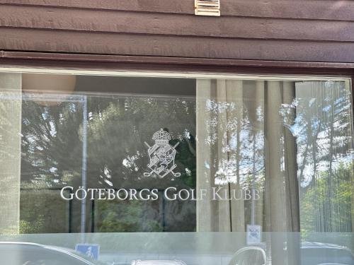 a glass window with a sign that reads coffeescourt kilt at Ground floor apartment near the sea, golf, lake, and forest in Hovås