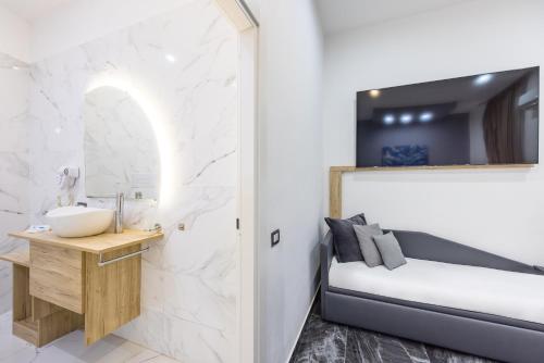 Letto o letti in una camera di Palace Napoli