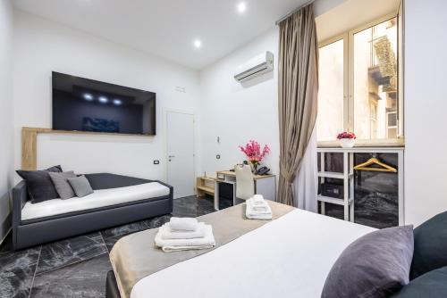 Letto o letti in una camera di Palace Napoli