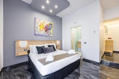 Letto o letti in una camera di Palace Napoli