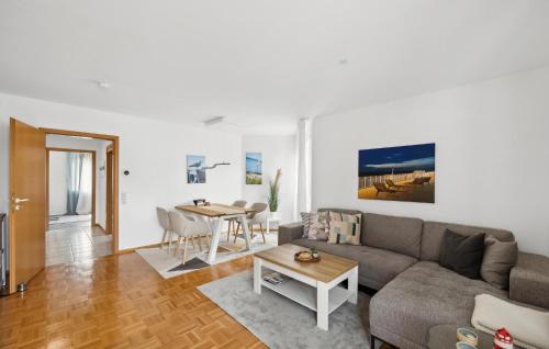 a living room with a couch and a table at Ahoi Chez Nous in Kehl am Rhein