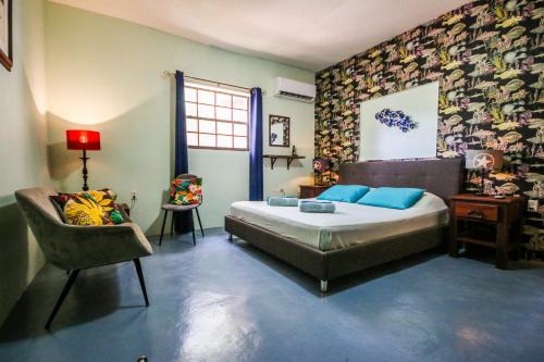 Postel nebo postele na pokoji v ubytování Woodstock Palmresort Curaçao