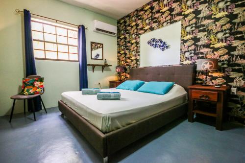 Postel nebo postele na pokoji v ubytování Woodstock Palmresort Curaçao