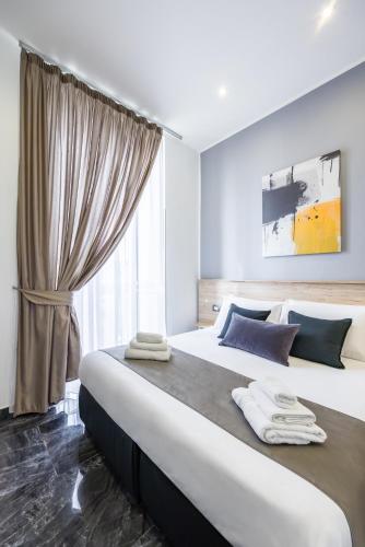 Letto o letti in una camera di Palace Napoli