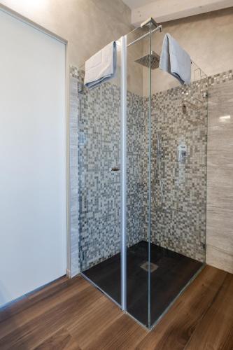 a shower with a glass door in a bathroom at Villa Vitali - Bellagio in Bellagio