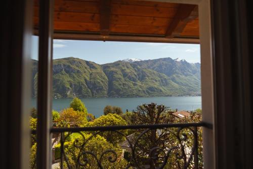 a view of a lake from a window at Villa Vitali - Bellagio in Bellagio