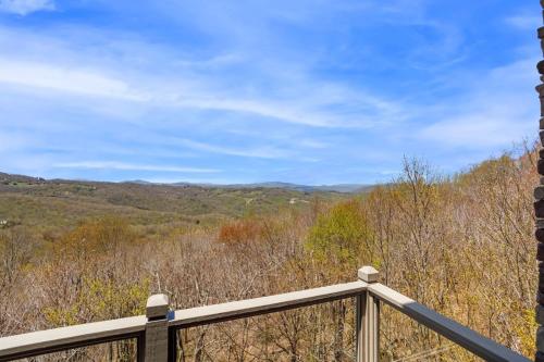 a view of the mountains from the deck of a house at Pipers Paradise in Beech Mountain