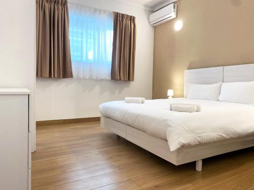 Letto o letti in una camera di Miami Apartments