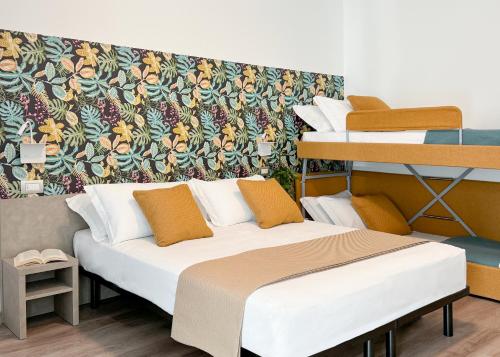 Postel nebo postele na pokoji v ubytování Nido Suite & Apartments