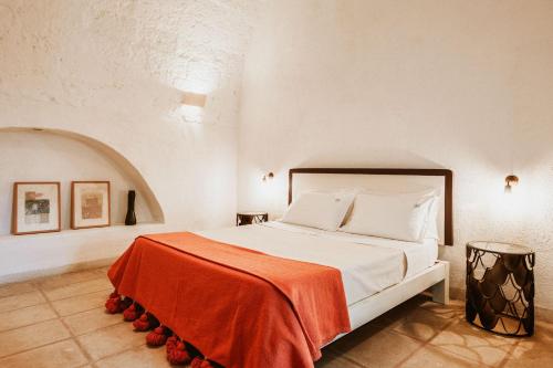 Ένα ή περισσότερα κρεβάτια σε δωμάτιο στο Masseria Li Foggi