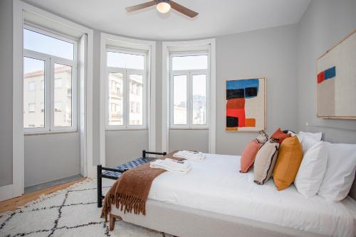 En eller flere senger på et rom på Liiiving in Porto - Art Design Apartment